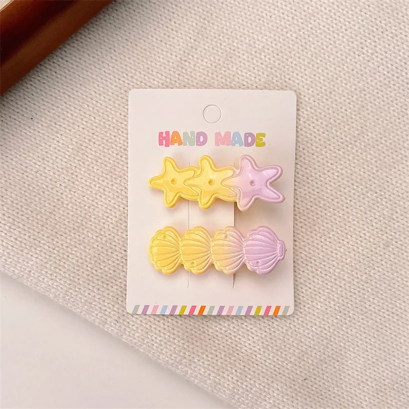 Pinza de pelo infantil con concha y estrella de mar - imagen 2