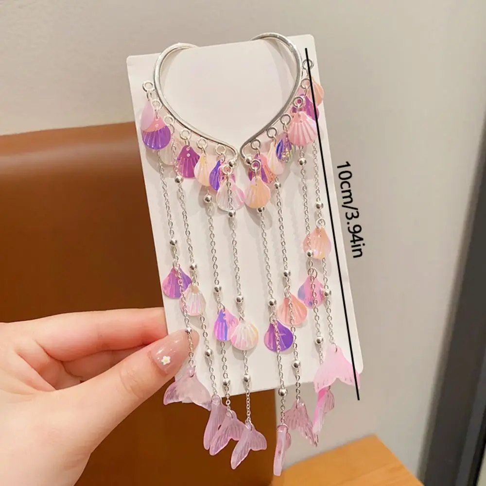 Pinza decorada con lazo de perlas y forma de hada
