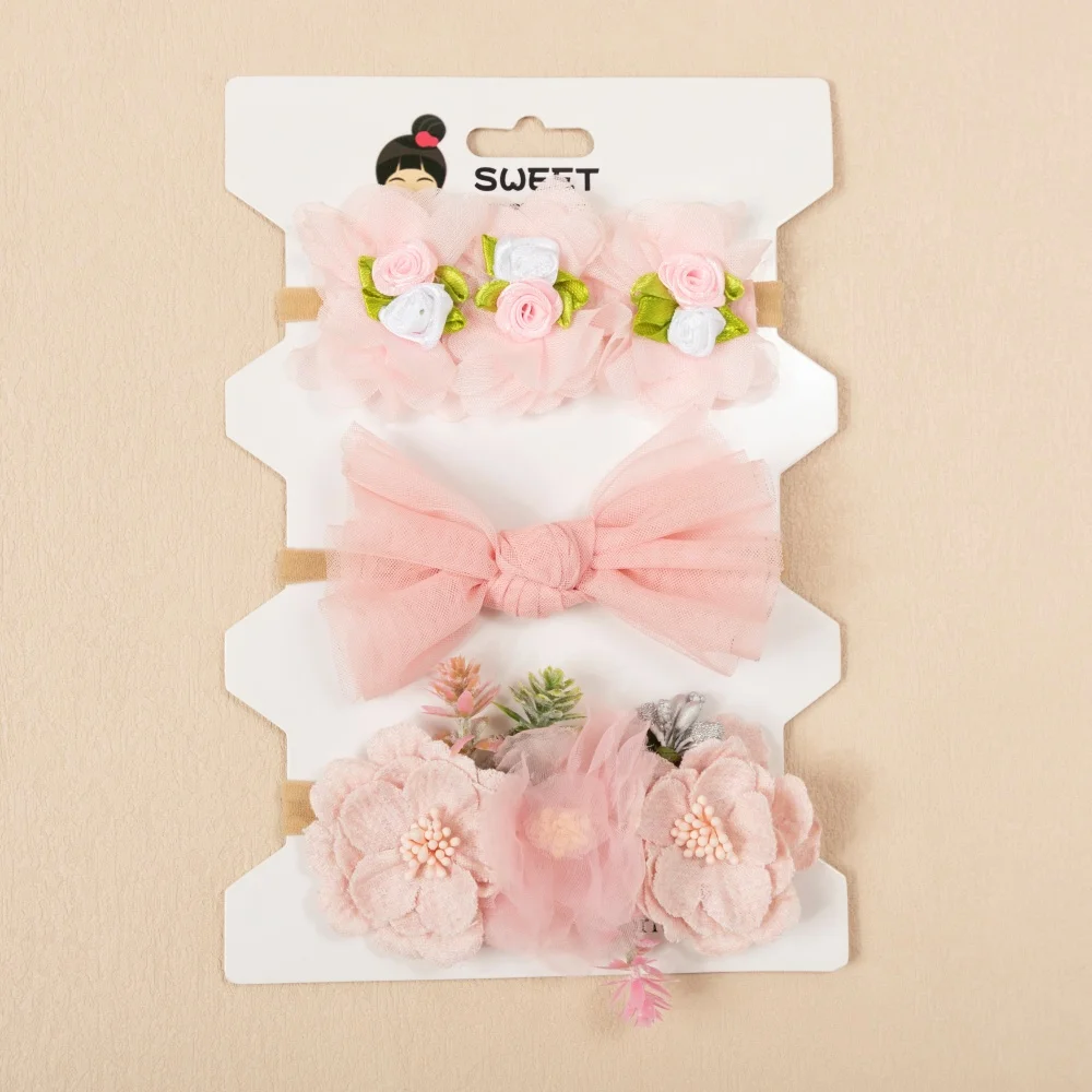 Diadema elástica de nailon con lazo floral rosa para bebé niña