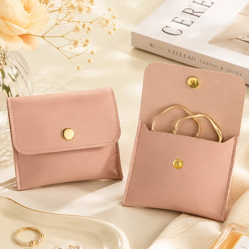 Bolsitas para joyas rosas con cierre, pendientes y pulseras - imagen 3