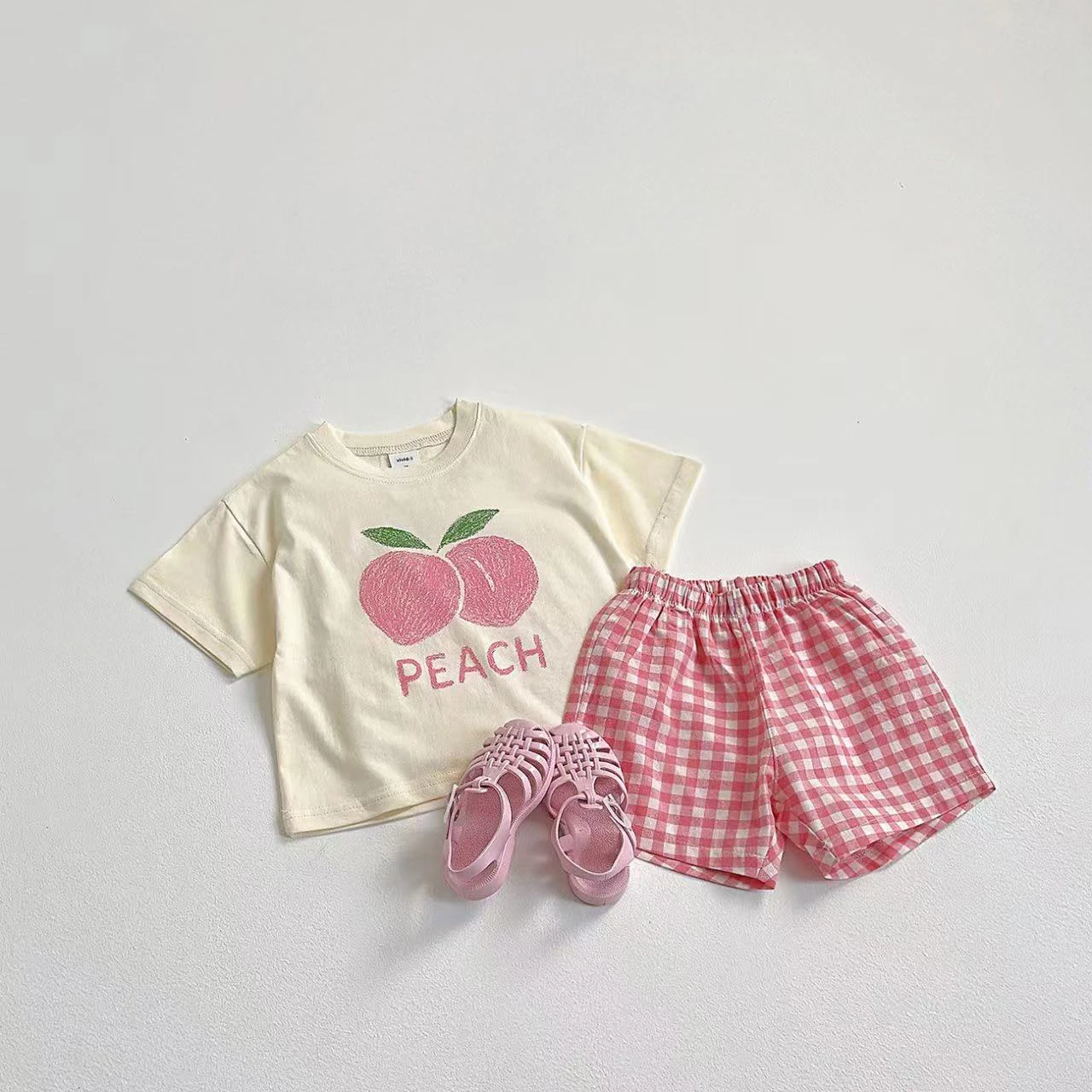 Conjunto infantil de 2 piezas con estampado de frutas