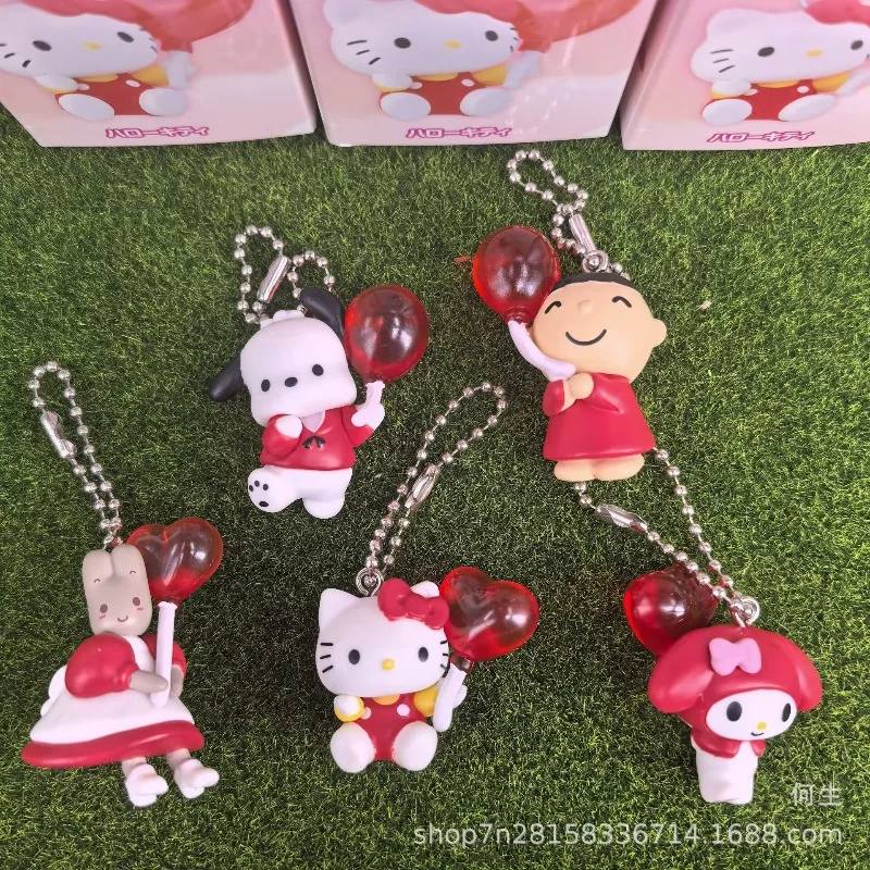 Muñeca colgante Hello Kitty caja ciega con globo rojo en crema