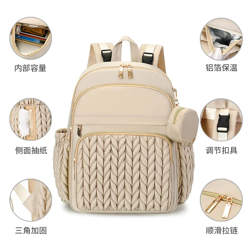 Mochila pañales con cambiador y accesorios para bebé en marcha