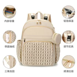 Mochila pañales con cambiador y accesorios para bebé en marcha