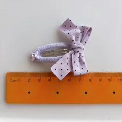 Accesorios para el cabello con lazo de lunares: pinzas y diademas