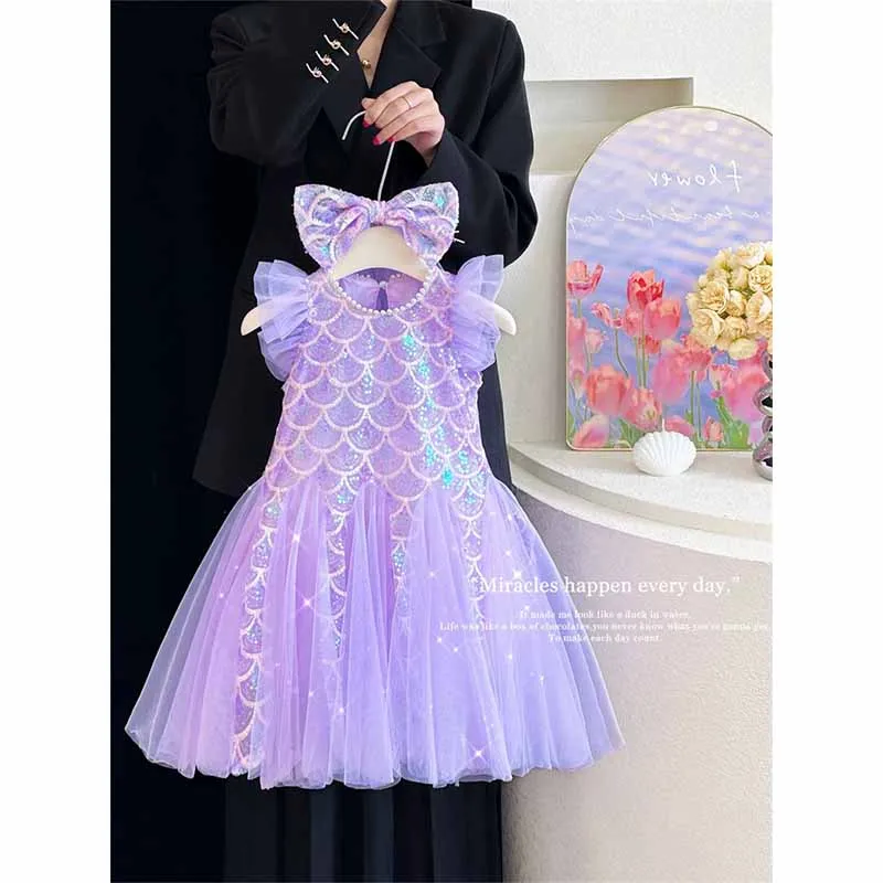 Vestido de tul con lentejuelas y mangas abullonadas
