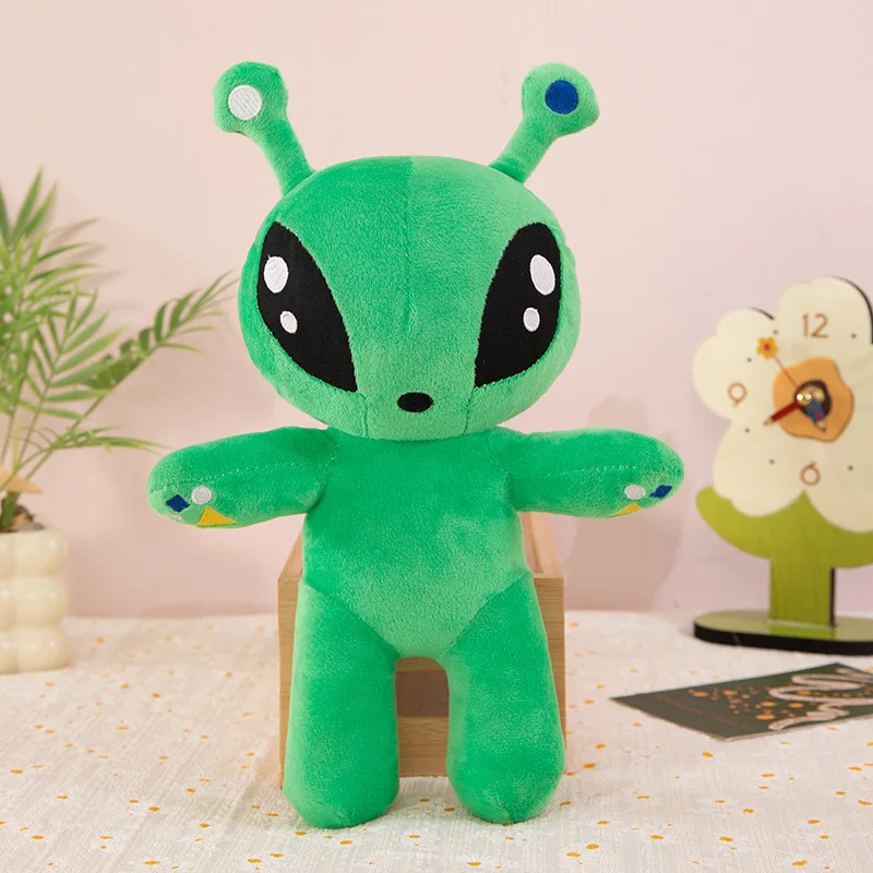 Peluche de alienígena verde con ojos grandes