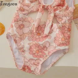 Bañador de niña sin mangas con estampado floral y concha