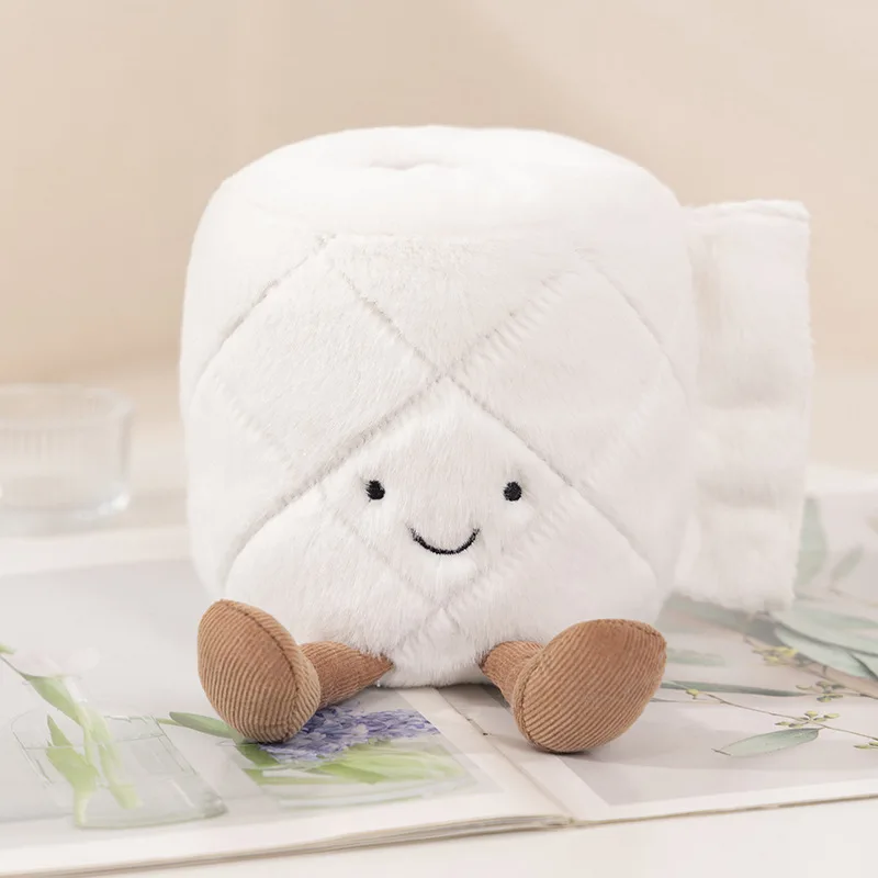 Niño sosteniendo el rollo de caca creativo sonriendo