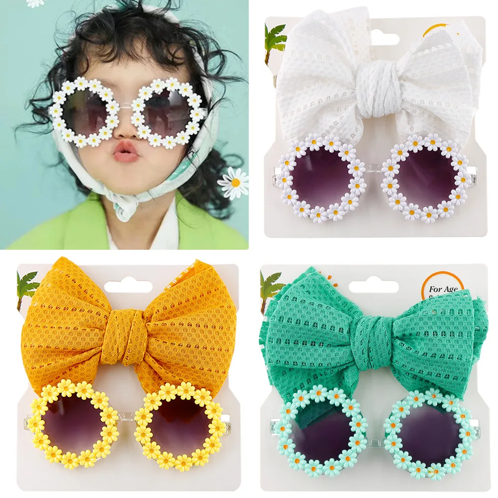 Gafas de sol infantiles con montura rosa y lentes oscuro