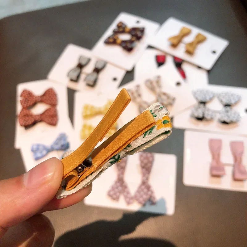 Pinzas para el pelo con lazo de tela color liso – bebé y niños