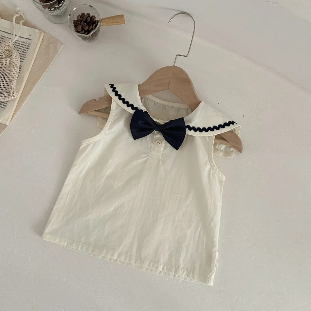 Conjunto bebé sin mangas con falda y lazo para verano - imagen 2