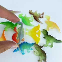 Figura de dinosaurio de goma blanda que brilla en la oscuridad
