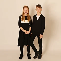 Vestido de cuero y algodón negro con tirantes y lazos para niña