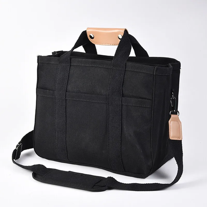 Bolso de mamá con compartimentos en lona para bebé y pañales