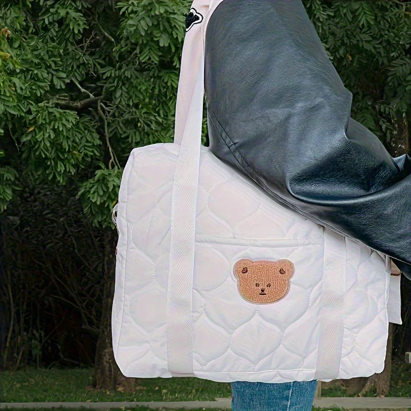 Bolsillo térmico para biberones y cambiador plegable integrado