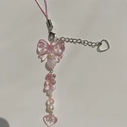Abalorio para teléfono con lazo plateado rosa y colgante corazón
