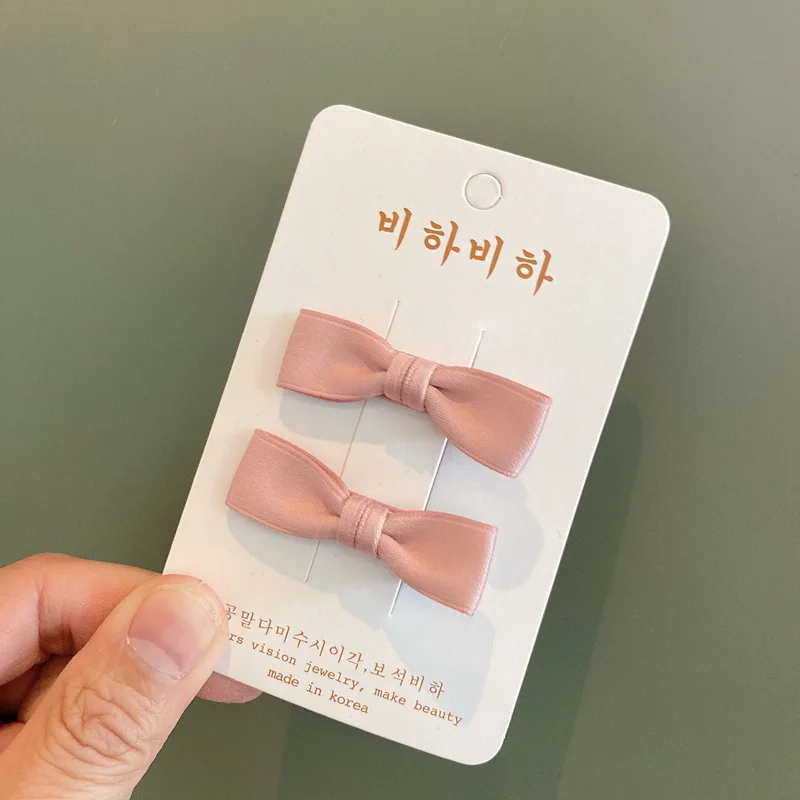 Pinzas para el pelo con lazo de tela color liso – bebé y niños - imagen 2