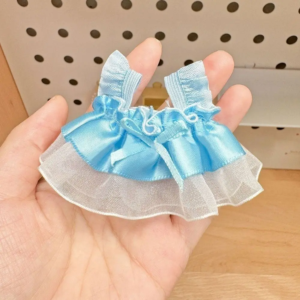Set de ropa de muñeca en estilos variados