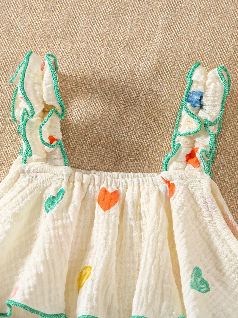 Mono tirantes niña de verano con estampado corazón y sombrero - imagen 2