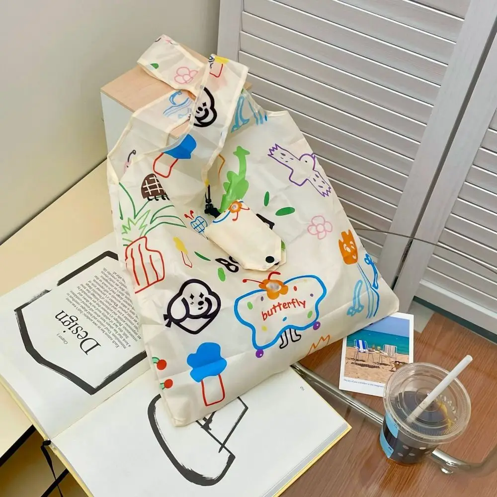 Bolsa plegable reutilizable impermeable con diseños de dibujos - imagen 2