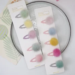 Horquillas para bebé con pompones en tonos pastel