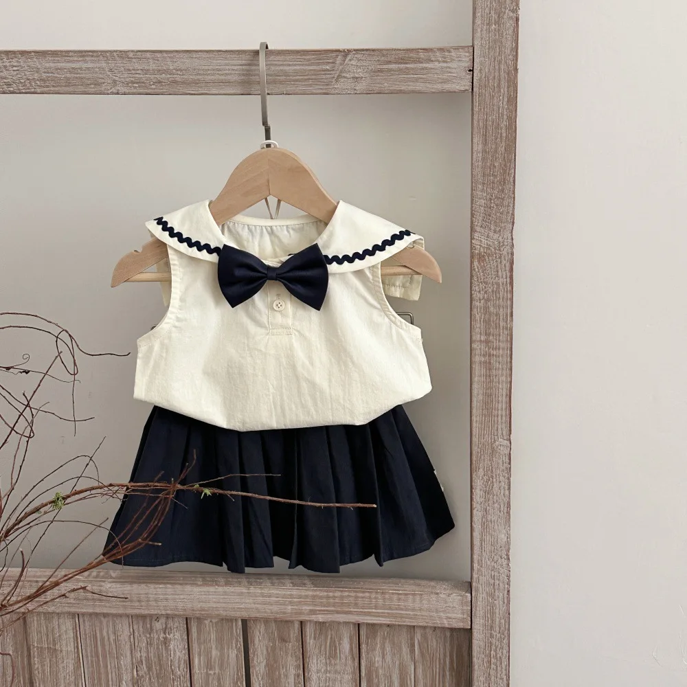 Conjunto bebé sin mangas con falda y lazo para verano - imagen 4
