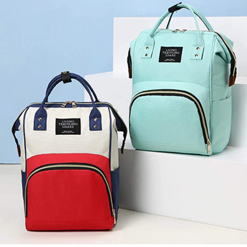 Vista frontal de la bolsa de lona KAIGUANG mostrando su diseño espacioso y asas resistentes