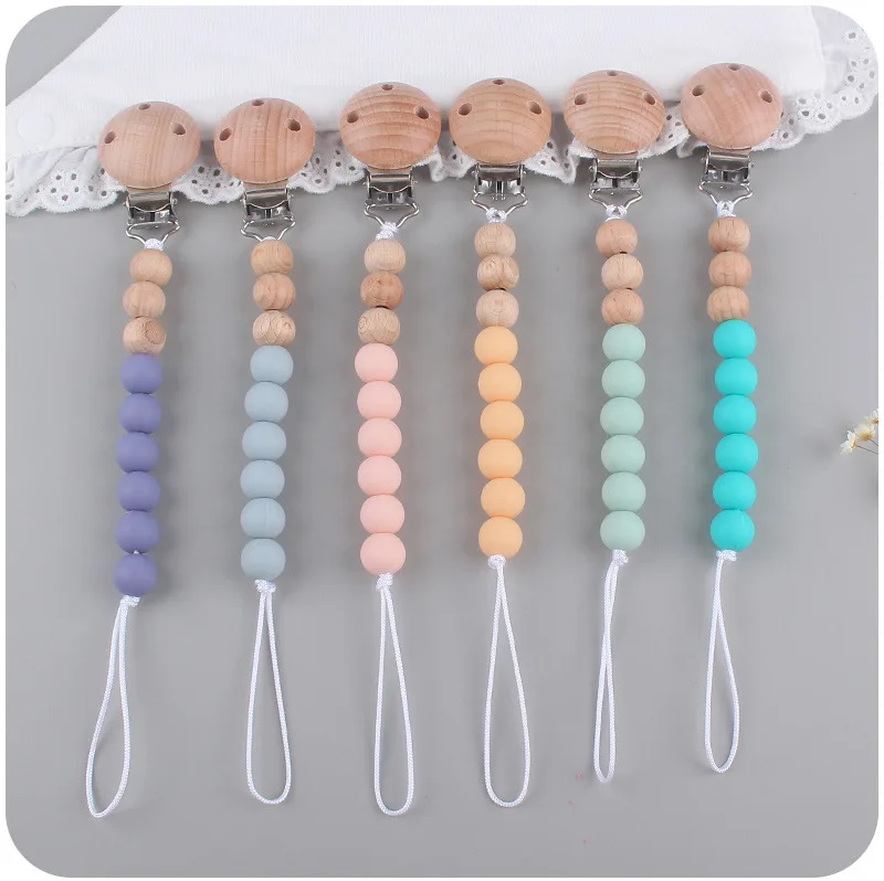 Clips para chupete de silicona en colores neutros
