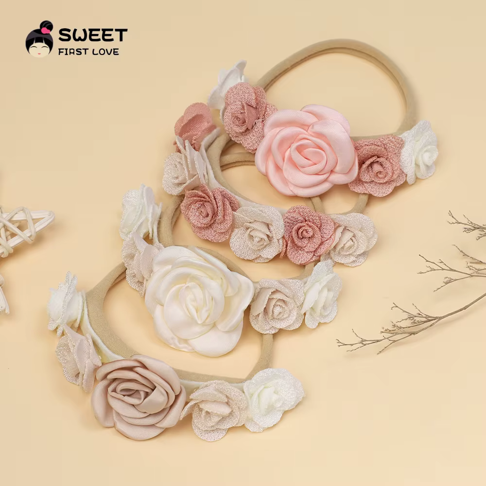 Diadema rosa con flor grande