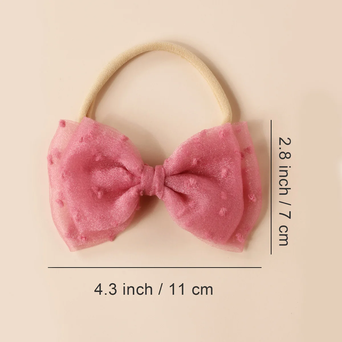 Diadema de bebé con lazo de gasa y diseño de color sólido