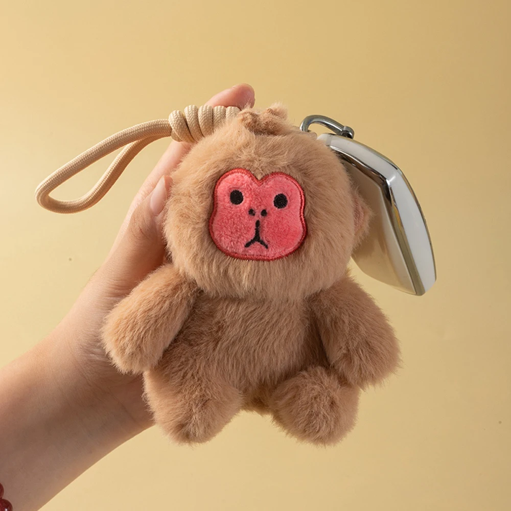 Llavero de peluche Saki mono dorado para mochila y carrito