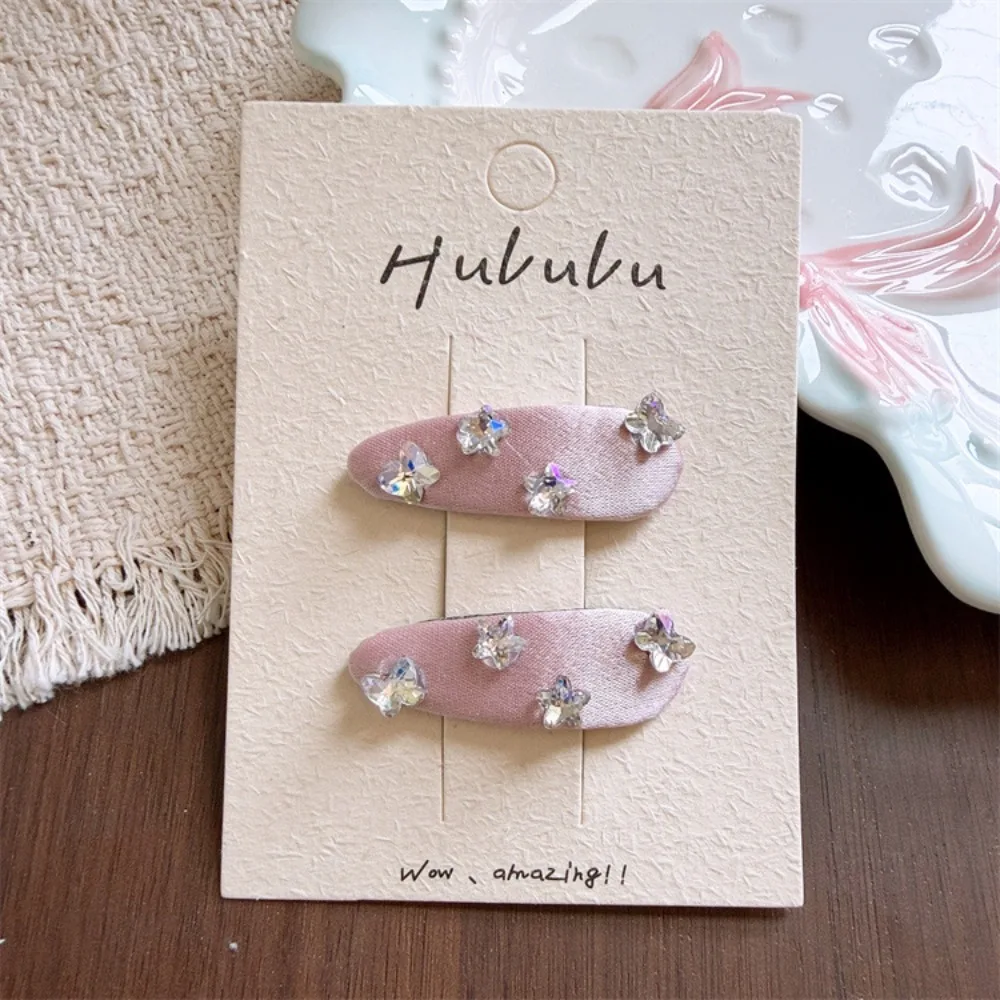 Pinzas para el pelo mariposa y estrella de tela con brillantes