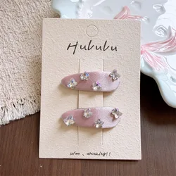 Pinzas para el pelo mariposa y estrella de tela con brillantes