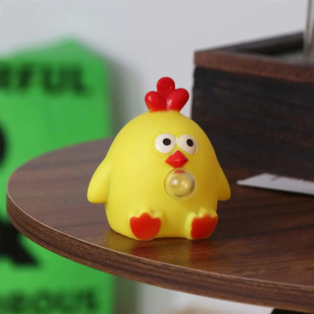 Juguete de apretar elástico con pollo para bebés
