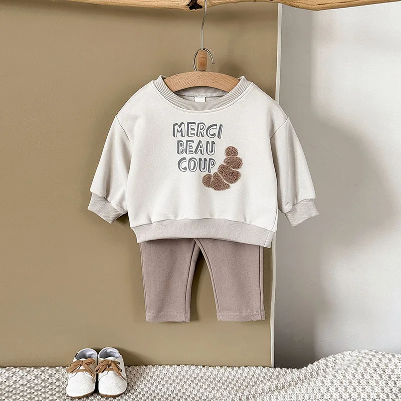 Textura de sudadera suave y pantalón de pana