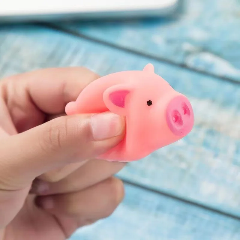 Mini cerdito rosa exprimible con sonido