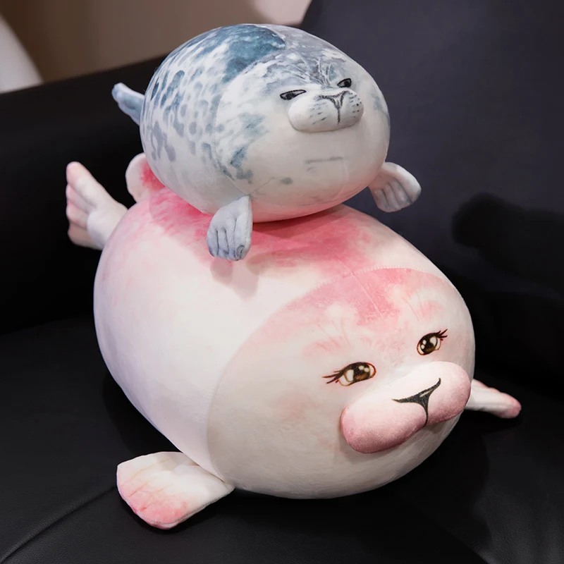 León marino de peluche azul y rosa