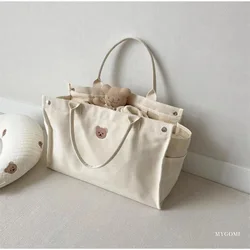 Bolsa pañalera de lona espaciosa con bolsillos para bebé