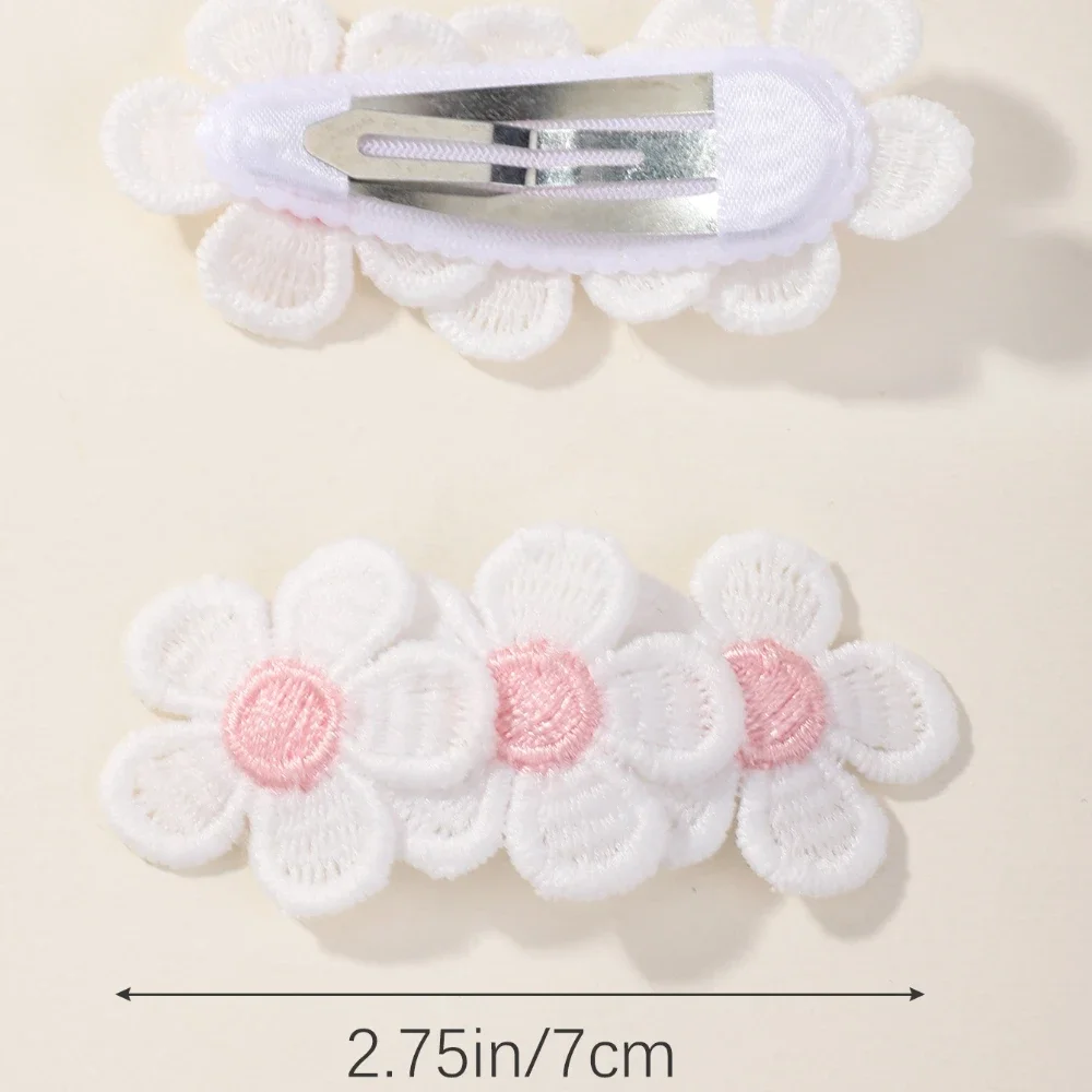 Pinzas infantiles con flores bordadas