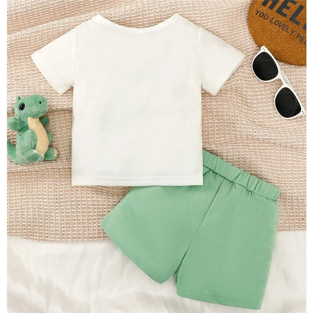 Conjunto deportivo bebé dinosaurios – Top blanco y pants marrón