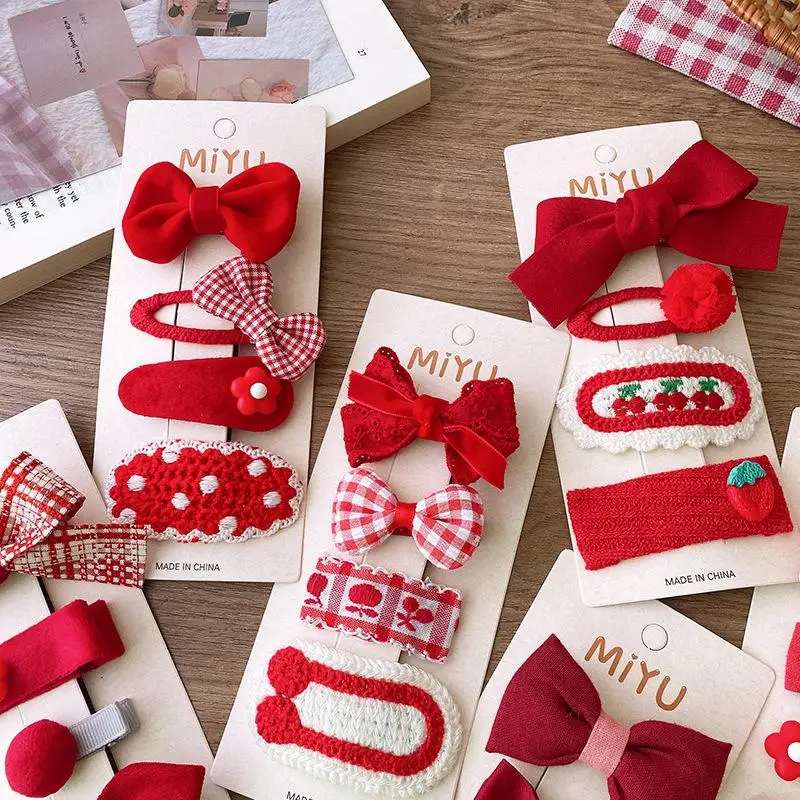 Horquillas rojas con lazo de tela y clip coreano para niñas