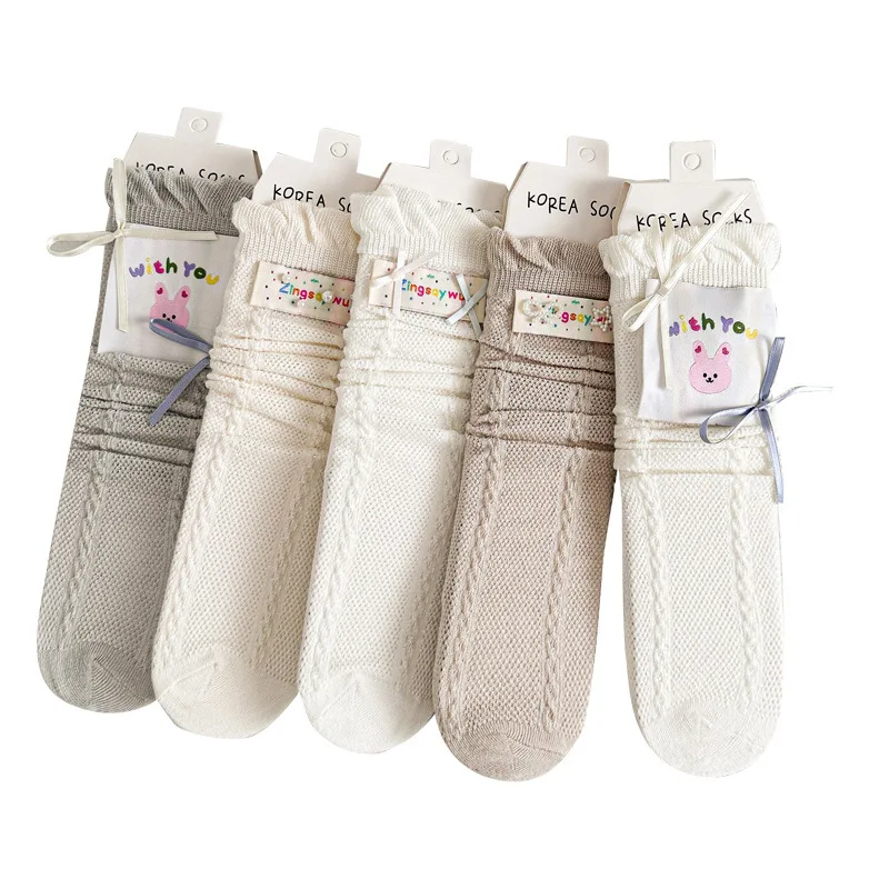 Calcetines finos de encaje con lazo y volantes para niño y niña - imagen 4