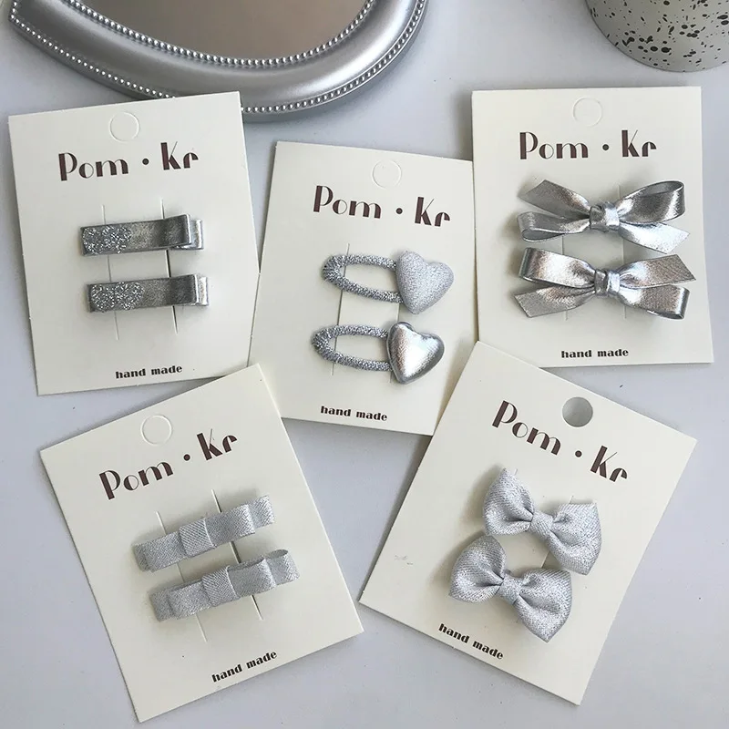 Pinzas de pelo cocodrilo con lazo plateado para bebés