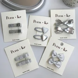 Pinzas de pelo cocodrilo con lazo plateado para bebés