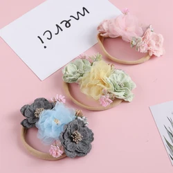 Diadema floral de gasa para bebé – Lazo elástico artesanal