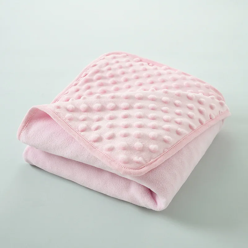 Manta con efecto burbujas en tono rosa