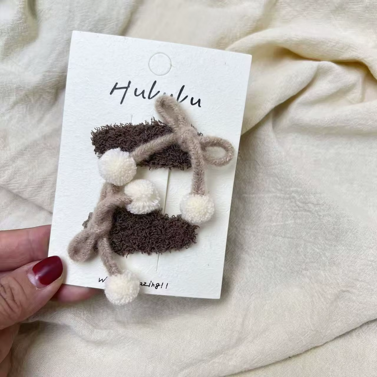 Pinzas de pelo con pompón y lazo para niña