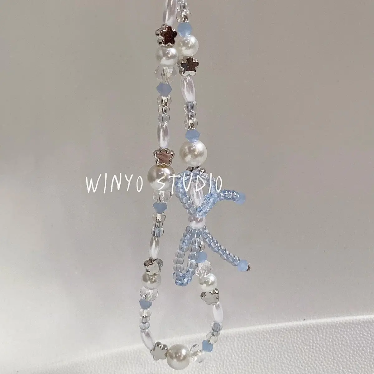 Colgante estrella con perla y lazo para iPhone infantil - imagen 4