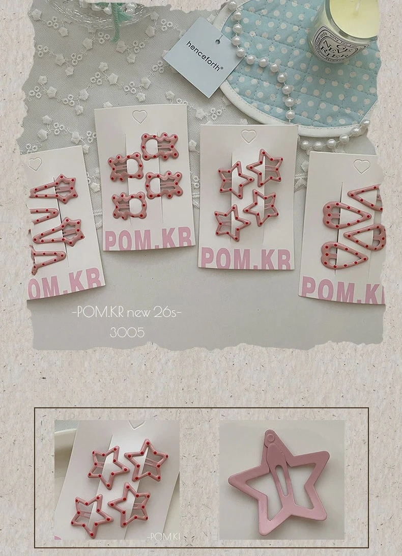 Pinzas con forma de estrella y puntos rosas